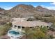 Sprawling home boasts an inviting pool and stunning mountain views in a picturesque desert community at 6602 N Arizona Biltmore Cir, Phoenix, AZ 85016