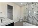 Stylish bathroom showcasing a glass-enclosed shower with marble tile, alongside a modern vanity and fixtures at 6602 N Arizona Biltmore Cir, Phoenix, AZ 85016