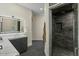 Bathroom features a modern vanity, sleek fixtures, and a luxurious shower with custom tile at 6602 N Arizona Biltmore Cir, Phoenix, AZ 85016