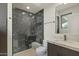 Elegant bathroom featuring a marble-tiled shower, modern vanity, and contemporary fixtures for a luxurious feel at 6602 N Arizona Biltmore Cir, Phoenix, AZ 85016