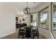 Bright breakfast nook features custom light fixture and views to the outdoor living space at 6602 N Arizona Biltmore Cir, Phoenix, AZ 85016