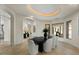 Bright dining room with hardwood floors, contemporary lighting, and large windows at 6602 N Arizona Biltmore Cir, Phoenix, AZ 85016