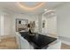 Dining room with white walls, tray ceiling, black table and contemporary decor at 6602 N Arizona Biltmore Cir, Phoenix, AZ 85016