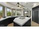 Gourmet kitchen with marble countertops, island, stainless appliances, and scenic window views at 6602 N Arizona Biltmore Cir, Phoenix, AZ 85016