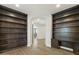 Elegant living room featuring custom bookshelves, hardwood floors, and an inviting layout for comfortable living and entertaining at 6602 N Arizona Biltmore Cir, Phoenix, AZ 85016