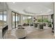 Spacious living room with modern furniture, large windows, and a balcony overlooking desert scenery at 6602 N Arizona Biltmore Cir, Phoenix, AZ 85016