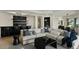 An open-concept living area with a wet bar, large sectional sofa and stylish decor at 6602 N Arizona Biltmore Cir, Phoenix, AZ 85016