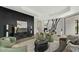 Expansive living area with open layout, marble fireplace, and a sleek modern design at 6602 N Arizona Biltmore Cir, Phoenix, AZ 85016