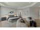 Bright main bedroom with modern furniture, decor and large windows overlooking the backyard at 6602 N Arizona Biltmore Cir, Phoenix, AZ 85016