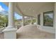 Covered patio with white columns and stone tile flooring, offering scenic mountain views at 6602 N Arizona Biltmore Cir, Phoenix, AZ 85016