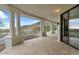 Outdoor patio with white columns, stone tile flooring, and a view of the desert landscape at 6602 N Arizona Biltmore Cir, Phoenix, AZ 85016