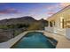 Stunning backyard pool with mountain views, patio, and columns provides a luxurious outdoor living space at 6602 N Arizona Biltmore Cir, Phoenix, AZ 85016