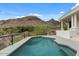 Backyard pool with stunning mountain views and a modern deck area at 6602 N Arizona Biltmore Cir, Phoenix, AZ 85016