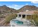 Inviting pool surrounded by desert landscape and mountain views provides a tranquil outdoor space for relaxation at 6602 N Arizona Biltmore Cir, Phoenix, AZ 85016
