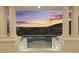 Backyard pool offers sunset and mountain views from covered porch with impressive stonework and architecture at 6602 N Arizona Biltmore Cir, Phoenix, AZ 85016