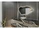 Modern powder room with marble countertop and contemporary mirror at 6602 N Arizona Biltmore Cir, Phoenix, AZ 85016