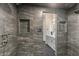 Modern shower featuring custom tile and a niche at 6602 N Arizona Biltmore Cir, Phoenix, AZ 85016
