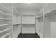 Bright, walk-in closet with custom shelving at 6602 N Arizona Biltmore Cir, Phoenix, AZ 85016
