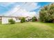 Large backyard with lush green grass and mature trees at 7844 N 17Th Ave, Phoenix, AZ 85021