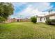 Spacious backyard with mature trees and a brick wall at 7844 N 17Th Ave, Phoenix, AZ 85021