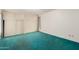 Spacious bedroom featuring sliding closet doors, built in storage, and plush green carpeting at 7844 N 17Th Ave, Phoenix, AZ 85021