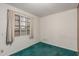 Simple bedroom featuring white walls and plush green carpet, accentuated by natural light at 7844 N 17Th Ave, Phoenix, AZ 85021