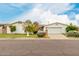 Charming single-story home featuring a two-car garage, mature landscaping, and a well-maintained lawn at 7844 N 17Th Ave, Phoenix, AZ 85021
