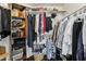Walk-in closet with shelving and hanging racks, offering ample storage space for clothes and accessories at 8354 W Surrey Ave, Peoria, AZ 85381