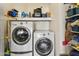 Efficient laundry room featuring side-by-side Whirlpool washer and dryer, with plenty of storage shelves at 8354 W Surrey Ave, Peoria, AZ 85381