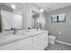 Bathroom showcasing double sinks, modern fixtures, and decorative tile flooring at 9422 E Southwind Ln, Scottsdale, AZ 85262