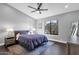 Stylish bedroom with a ceiling fan, neutral decor, and modern furnishings at 9422 E Southwind Ln, Scottsdale, AZ 85262