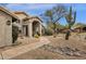 Attractive home featuring low maintenance desert landscaping and a covered entryway at 9422 E Southwind Ln, Scottsdale, AZ 85262