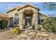 Stunning home featuring a columned entry and well-maintained desert landscaping at 9422 E Southwind Ln, Scottsdale, AZ 85262