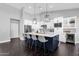 Modern kitchen with island seating, stainless steel appliances, and ample counter space at 9422 E Southwind Ln, Scottsdale, AZ 85262