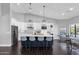 Spacious kitchen with large island, breakfast bar, stainless steel appliances, and modern design at 9422 E Southwind Ln, Scottsdale, AZ 85262