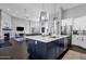 Open kitchen with island, stainless steel appliances, and view of the living area at 9422 E Southwind Ln, Scottsdale, AZ 85262