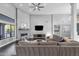 Expansive living room with modern fireplace and open access to the kitchen at 9422 E Southwind Ln, Scottsdale, AZ 85262