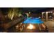 Beautiful outdoor oasis featuring a sparkling pool, spa, and a cozy fire pit area at 9422 E Southwind Ln, Scottsdale, AZ 85262