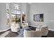 Bright seating area features large windows and desert views at 9422 E Southwind Ln, Scottsdale, AZ 85262