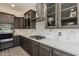 Close up of kitchen with white countertops, tile backsplash, and updated stainless appliances at 9535 E Los Lagos Vista Ave, Mesa, AZ 85209