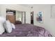 Bedroom featuring a queen-size bed and sliding closet doors at 9705 E Mountain View Rd # 1064, Scottsdale, AZ 85258