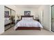 Bedroom featuring a queen-size bed, sliding mirror closet doors, and private balcony at 9705 E Mountain View Rd # 1064, Scottsdale, AZ 85258
