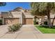 Charming townhome with a two-car garage and desert landscaping at 9705 E Mountain View Rd # 1064, Scottsdale, AZ 85258