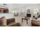 Open living room features a cozy fireplace and natural light at 9705 E Mountain View Rd # 1064, Scottsdale, AZ 85258