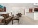 Spacious living area with a view of the kitchen and front entrance at 9705 E Mountain View Rd # 1064, Scottsdale, AZ 85258