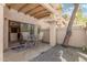 Relaxing outdoor patio with stone flooring, desert landscaping and seating at 9705 E Mountain View Rd # 1064, Scottsdale, AZ 85258