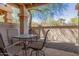 Relaxing outdoor patio with stone flooring, desert landscaping and seating at 9705 E Mountain View Rd # 1064, Scottsdale, AZ 85258