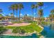 Lush landscaping with palm trees, water feature, and scenic community setting at 9705 E Mountain View Rd # 1064, Scottsdale, AZ 85258