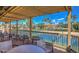 Covered patio overlooking tennis courts, offering a shaded viewing area with comfortable seating and views at 9705 E Mountain View Rd # 1064, Scottsdale, AZ 85258