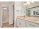 Bright bathroom with a large vanity, granite countertop, walk-in shower, and a closet at 10610 S 48Th St # 1068, Phoenix, AZ 85044